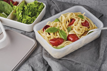 Pasta with roasted tomatoes and basil in lunchbox