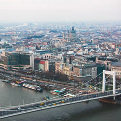 Obraz premium Beautuful super-wide angle aerial view of Budapest, Hungary, with Danube river and scenery beyond the city, seen from observation point of Gellert Hill