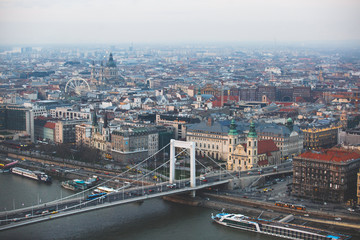 Beautuful super-wide angle aerial view of Budapest, Hungary, with Danube river and scenery beyond the city, seen from observation point of Gellert Hill