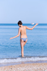Girl entering in sea water in morning time