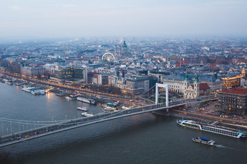 Beautuful super-wide angle aerial view of Budapest, Hungary, with Danube river and scenery beyond the city, seen from observation point of Gellert Hill