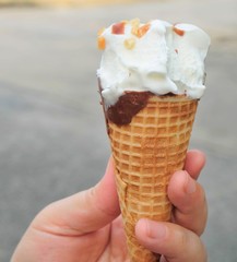 Hand Holding Ice Cream Cones with Chocolate
