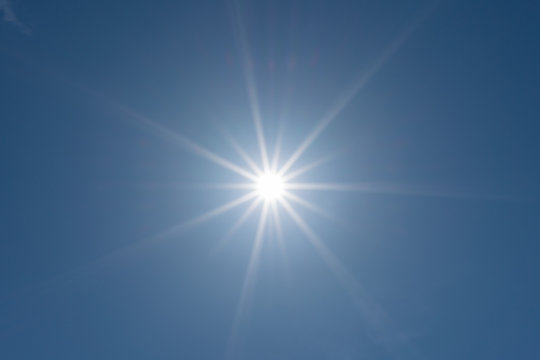 Sun and blue sky background