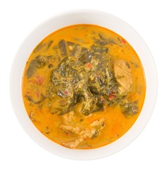 Top View Coconut Milk Curry with Cassia Leaves on White