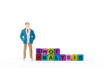 Businessman or manager with SWOT ANALYSIS text made from colorful beads or letter bead on white background, finance and business concept.