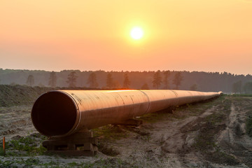 Gas pipeline under construction with a scenic sunset sky background 