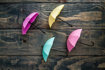 Colorful Mini Umbrellas on Blue Wooden Background