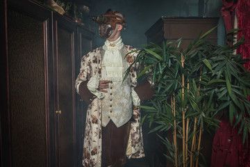 Actor in steam punk masks and antique costumes indoor.