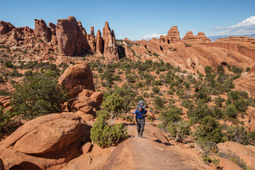 A family with baby son visits Arches National Park in Utah, USA