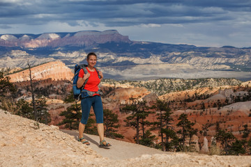 Fototapeta premium Hiker visits Bryce canyon National park in Utah, USA