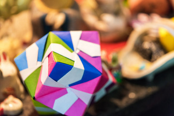 Multicolored cube in origami technique in Kyoto, Japan. Close-up