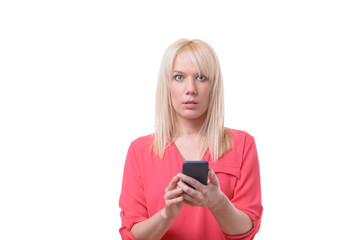 Blond woman staring wide eyed at the camera