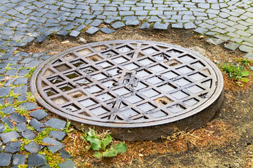 Hatch cover, city drain on the road, city sewerage