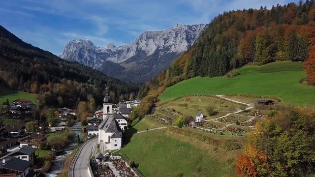 Flight around famous Parish church St. Sebastian, in Ramsau, Berchtesgaden, Bavarian Alps, Germany