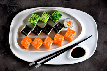 Delicious sushi with salmon, soft cheese and tobiko caviar. Japanese food.