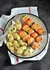 baked chicken breast shish kebab with red onion, zucchini, red pepper and boiled baby potatoes with dill and olive oil.