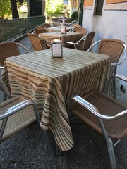 Empty Chairs at an Outdoor Cafe and Spanish Restaurant in Madrid 