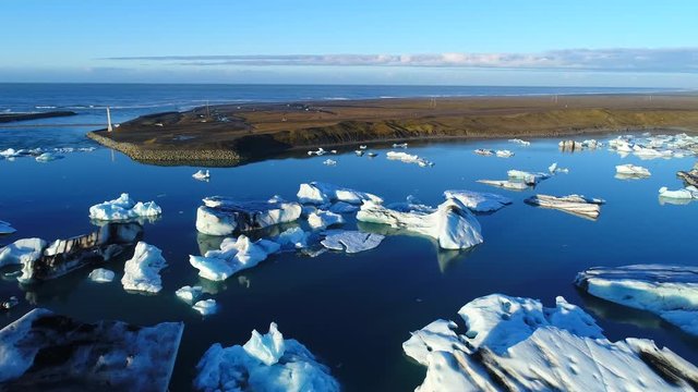4K Aerial movie Flyover Over Glacier Pieces Lagoon ,Jokulsarlon In Iceland 