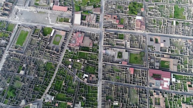 Aerial view of Pompeii showing the ancient Roman city the Forum Pompeii and Temple of Apollo located near Naples Italy it was mostly destroyed and buried under volcanic ash and pumice of Vesuvius 4k