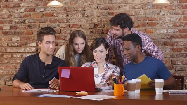 Young business professionals planning on a computer