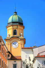 City clock tower Gradski toranj a Baroque landmark building of Croatian seaport town in sunny summer day against blue sky at main street Korzo of city, Rijeka Croatia Balkan peninsula Southeast Europe
