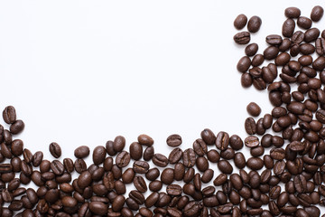 Roasted coffee beans on white background