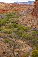 View of Fruita, Utah from the Cohab Canyon Trail. Fruita was an early Mormon settlement in the Capitol Reef area of south-central Utah. Red rock and sandstone cliffs dominate the environment.