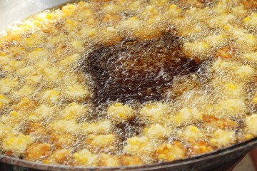 Making fried corn cake in the pan