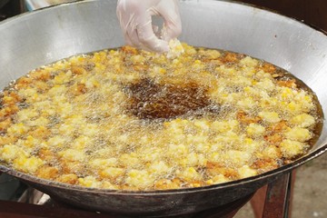 Making fried corn cake in the pan
