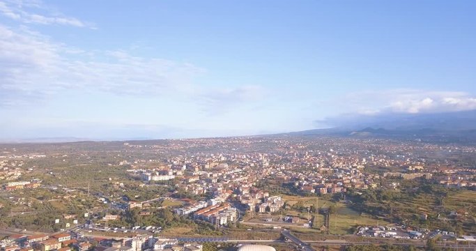 Aerial view of the Catania city from above with Etna volcano on the background