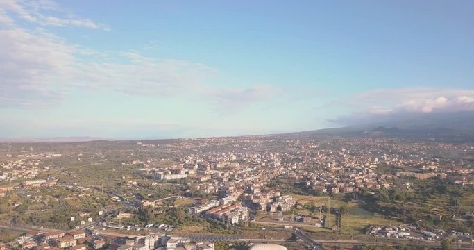 Aerial view of the Catania city from above with Etna volcano on the background