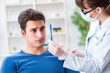Doctor checking up patient in first aid concept