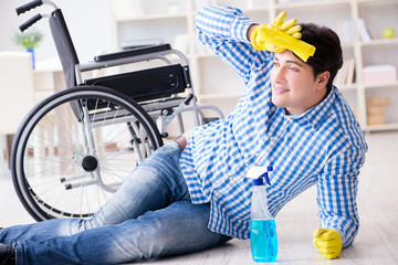 Disabled man on wheelchair cleaning home
