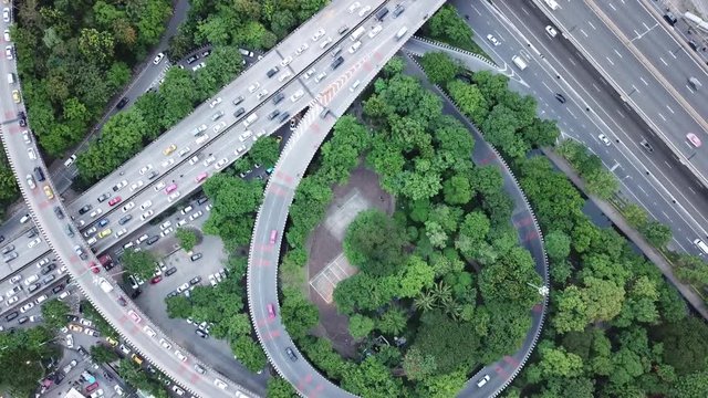 Traffic street intersection circle roundabout in Bangkok, Thailand. 4K UHD horizontal aerial view from a drone
