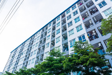 Obraz na płótnie Canvas Real estate modern condominium window blue sky