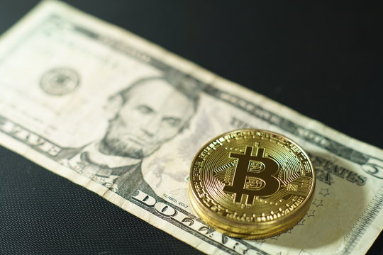 Bitcoin stack on multi national banknote bill background, bitcoin concept, dollar, baht, ringit, peso