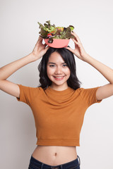 Healthy Asian woman with salad.