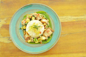spicy stir fried sweet roasted and crispy pork with basil leaf on rice