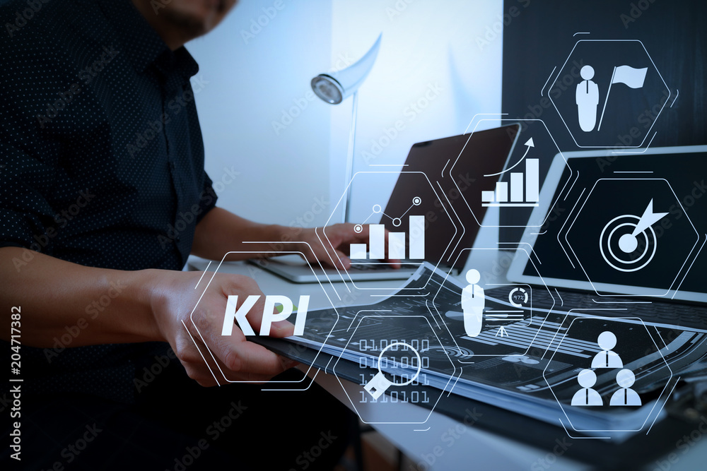 Poster businessman working with smart phone and digital tablet and laptop computer and document in modern o