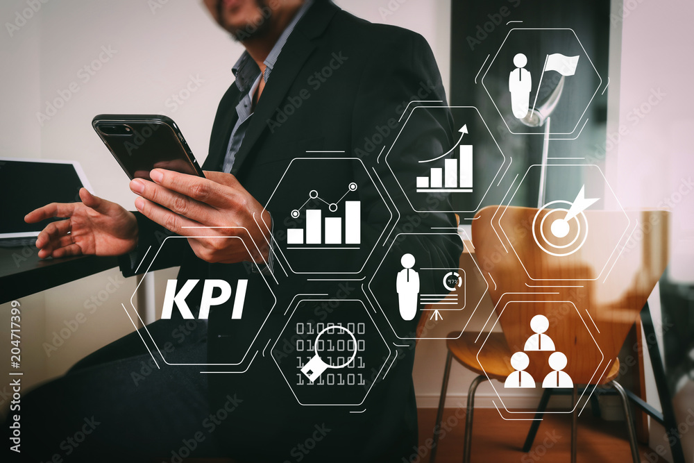 Poster businessman working with smart phone and digital tablet and laptop computer in modern office