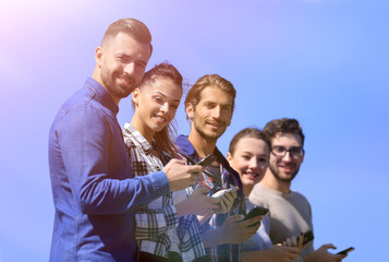 group of young people with modern smartphones.