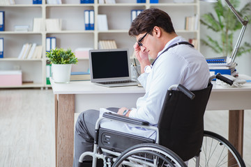 Disabled doctor on wheelchair working in hospital