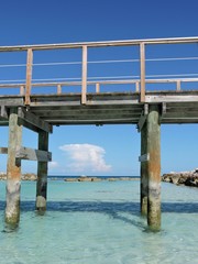 Wooden bridge in turquoise water, Bahamas