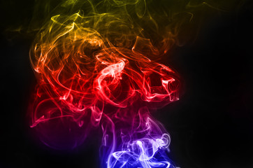 abstract fragment movement of colorful smoke on black background.