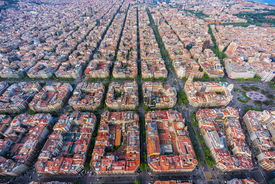 Barcelona aerial wide angle view, Eixample residencial district urban area, Spain. Late afternoon light