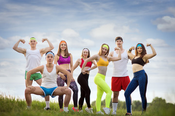 Group of sports people on the grass