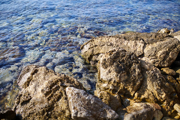 clean sea water and a stone beach