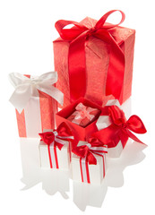 Bright gift boxes for holiday with ribbons and bows isolated on white