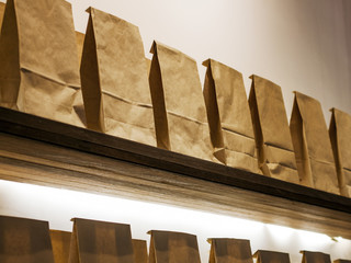 Range of Paper Bags on the Shelf. - Powered by Adobe