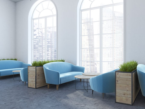 Arched window cafe interior, cyan sofas